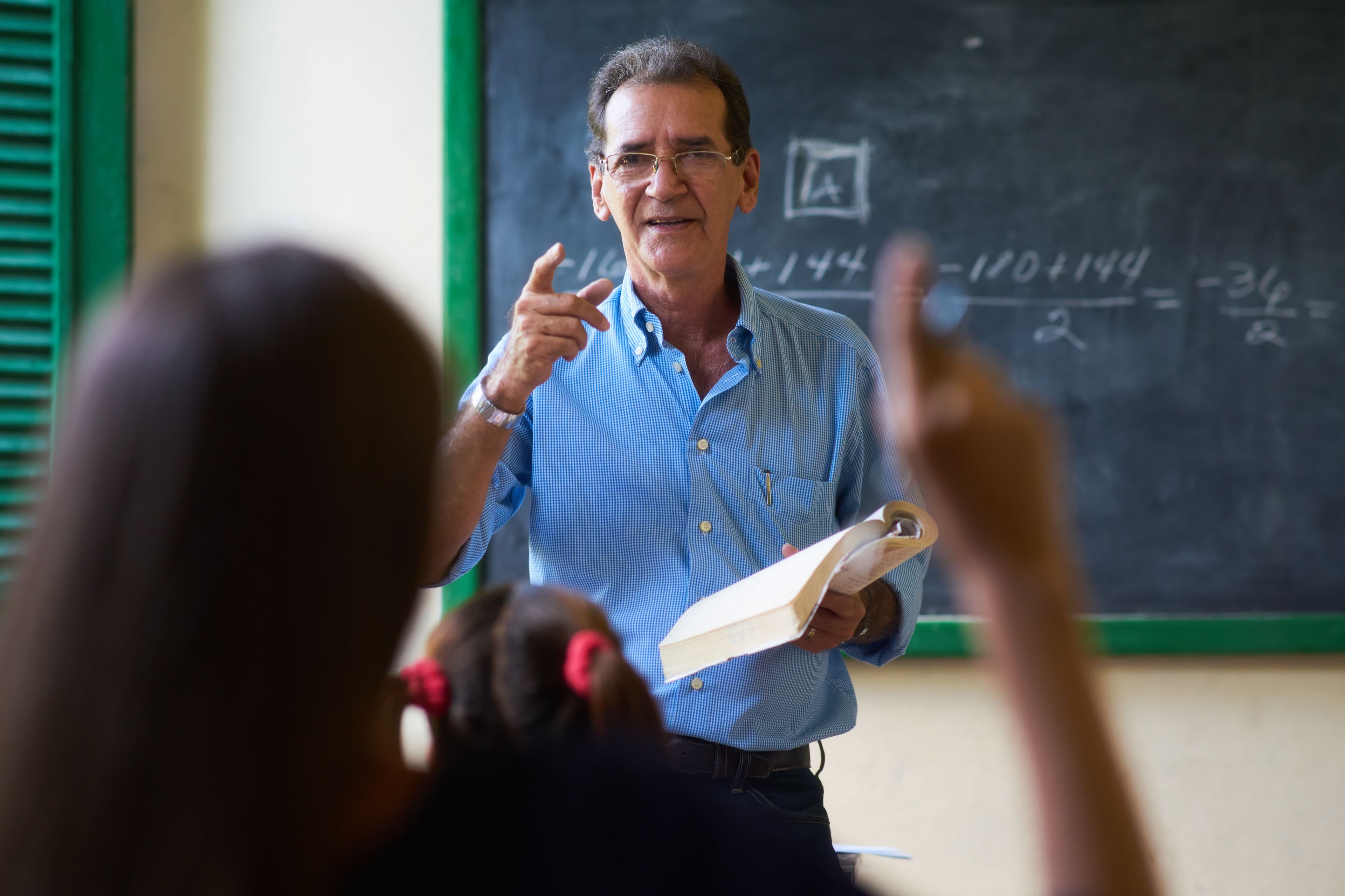 Teacher calling upon student